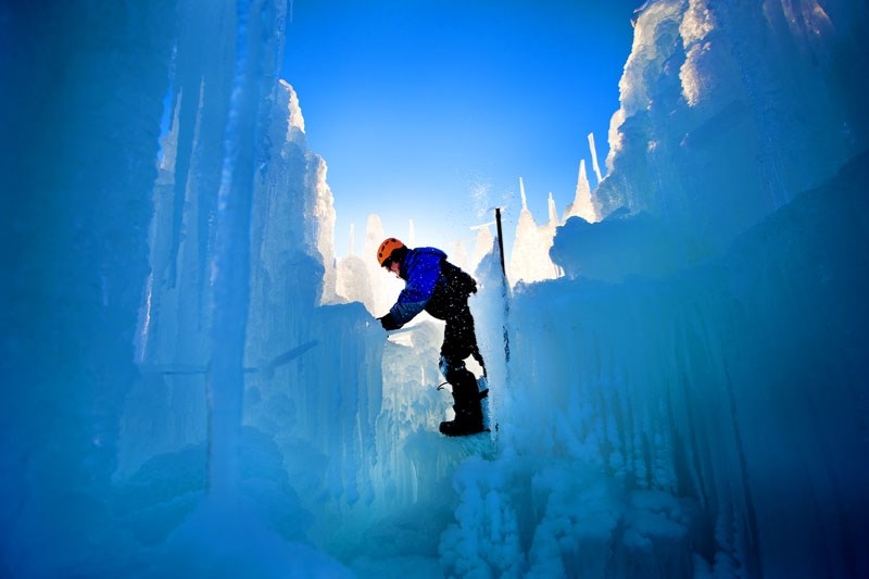 ce Castle employee Donovan Douziech works on an ice formation at William Hawrelak Park Dec. 15.