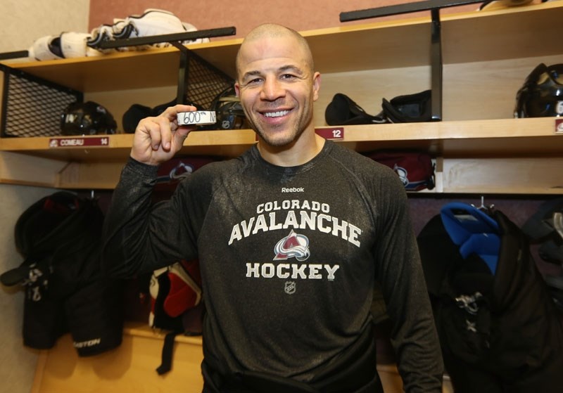 MILESTONE â€“ Jarome Iginla of the Colorado Avalanche displays the puck for his 600th career goal in the team&#8217;s dressing room after Monday&#8217;s 4-1 win over the Los