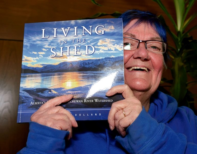 NEW BOOK â€” St. Albert author Billie Milholland shows off the cover of her new book on the North Saskatchewan watershed