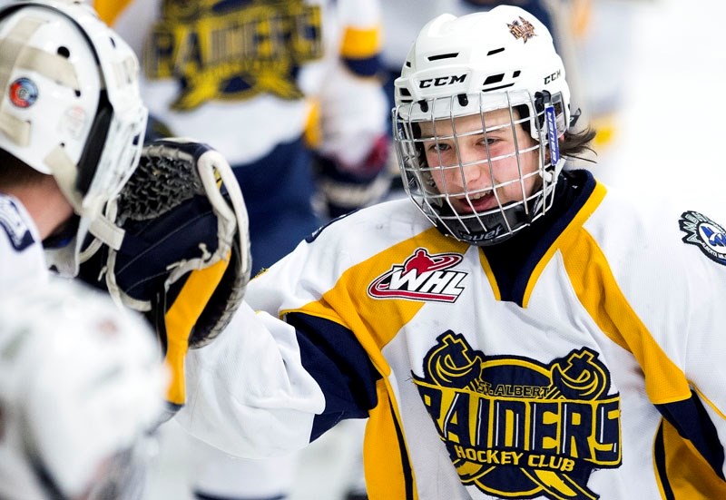 GOAL IS TO WIN â€“ Logan McKinley celebrates a goal for the St. Albert Gregg Distributors Sabres in the Alberta Major Bantam Hockey League. The Sabres are striving to win the 