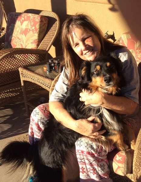 CLOSE CALL â€“ Horse-trainer Tracy Matkea hugs her dog