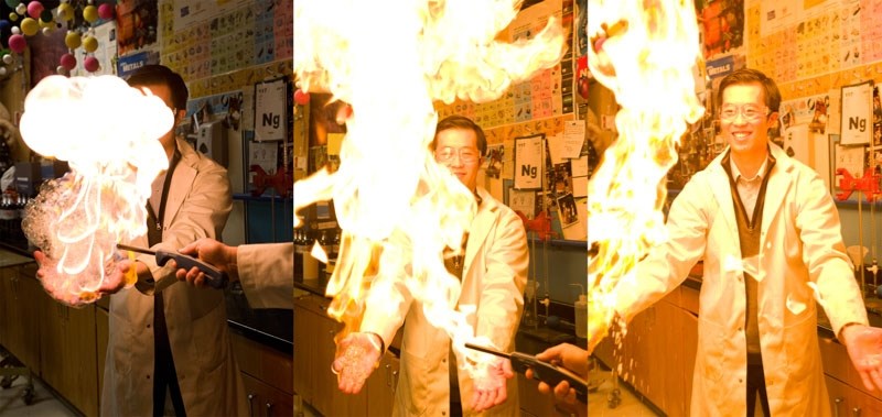 FWOOSH! â€” Paul Kane chemistry teacher Michael Ng demonstrates the specific heat capacity of water by igniting methane-filled bubbles in his hands. The water in the bubbles
