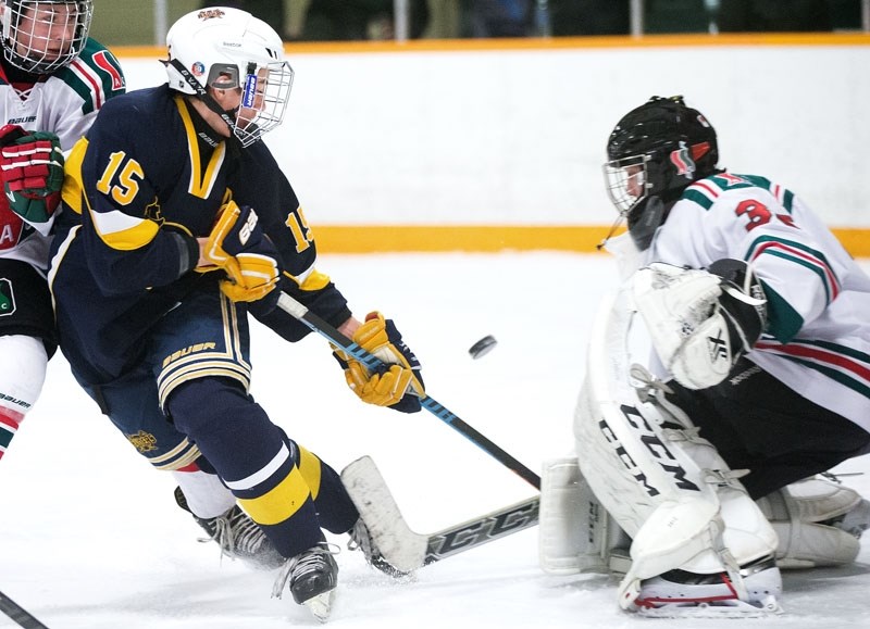 SCORING CHANCE &#8211; Mats Olson of the St. Albert Comets attacks the net against Bradley Fraser of SSAC Barbecue County during a game between the Edmonton Rural Bantam AA