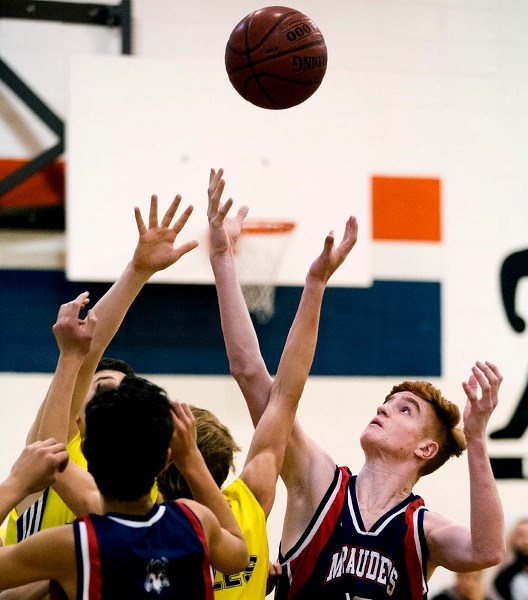 REELING IT IN &#8211; Travis Heggart of the Vincent J. Maloney Marauders reaches for the ball against the Sturgeon Heights Eagles in the third-place A division game at the