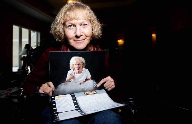 Youville Home resident Penny Stiksma poses with her photo as Miss March &#8211; Marilyn Monroe in the facility&#8217;s new fundraising calendar. Proceeds from sales go to