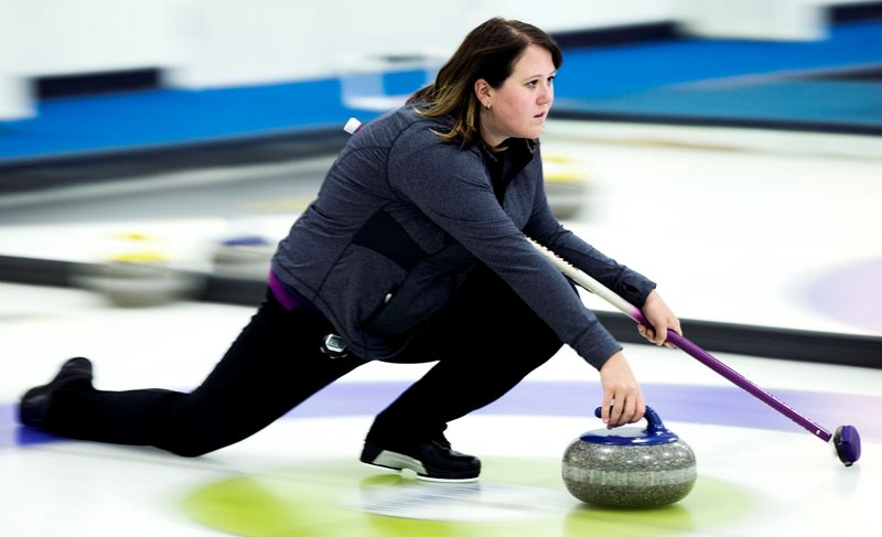 ROCKING THE HOUSE &#8211; Melissa Kledeck slides into her delivery at the St. Albert Curling Club. This weekend the St. Albert club is hosting the Drayden Insurance Stick