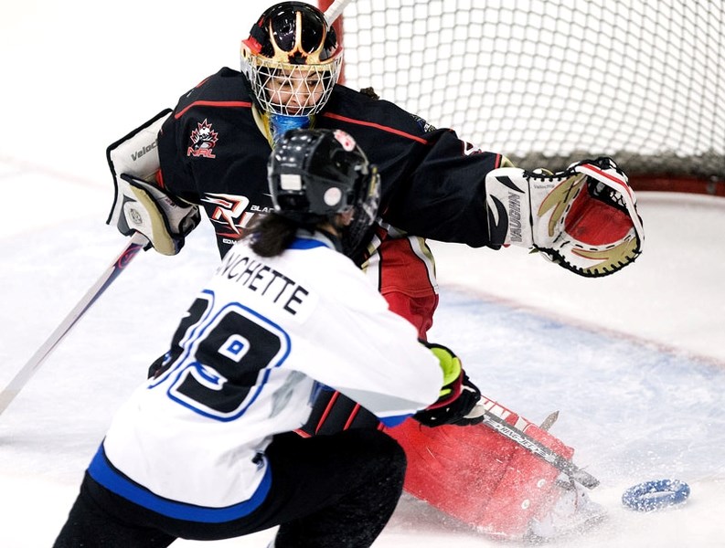 RINGING THE NET &#8211; Julie Blanchette of the Montreal Mission attempts to score against Black Gold Rush netminder Anj Grewal in Saturday&#8217;s National Ringette League