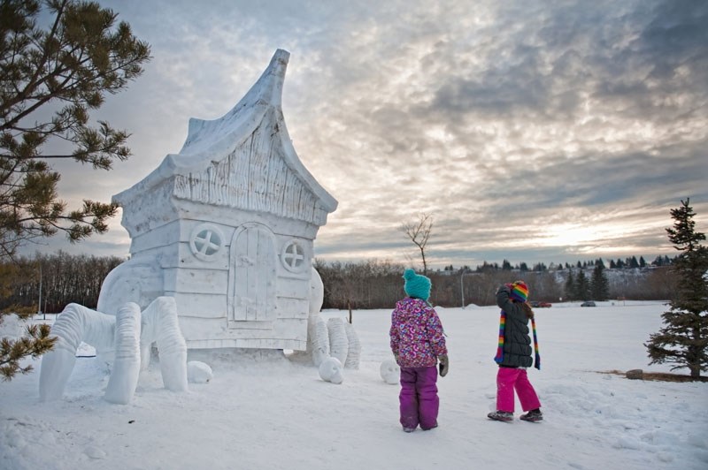 Two children stand by the witch Baba Yaga&#8217;s claw-foot house. Bottom