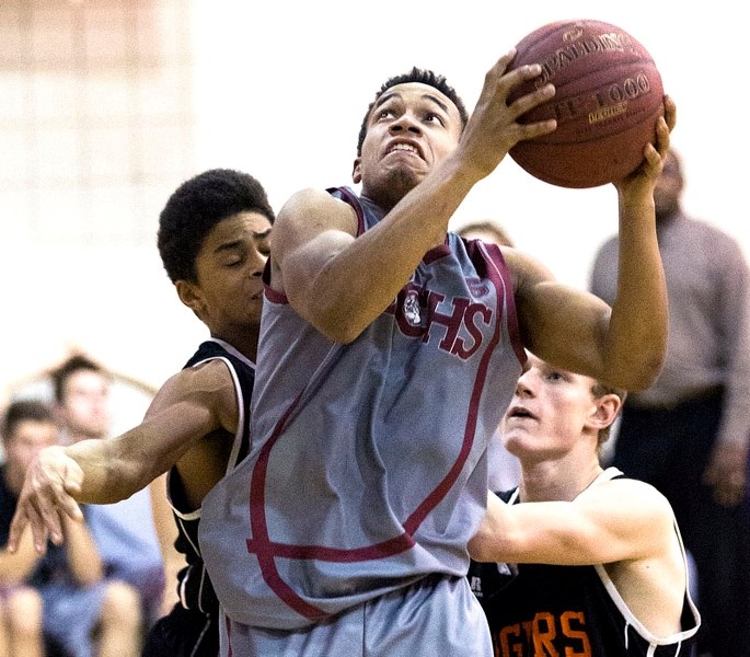 SHOW OF FORCE &#8211; Darryl Broderick of the Bellerose Bulldogs powers his way to the hoop in metro Edmonton division one action at Bellerose Composite HIgh School. Today at 