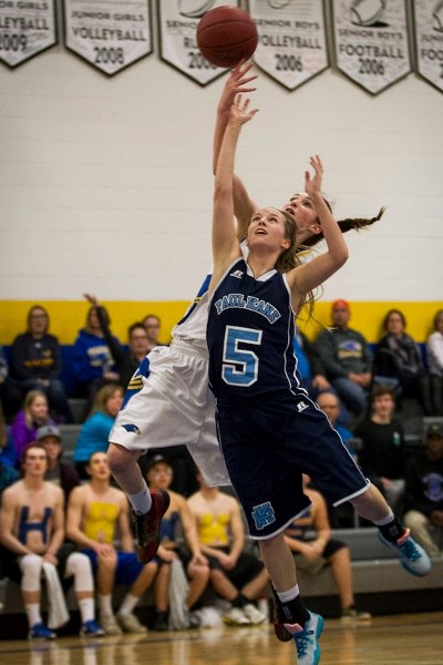 STRETCH PLAY &#8211; Sarah Dedrick of the St. Albert Skyhawks attempts to block a scoring attempt by Jenell Desharnais of the Paul Kane Blues in Monday&#8217;s metro Edmonton 
