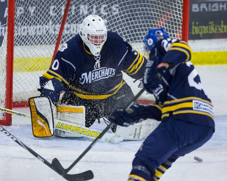 FOCUSED &#8211; St. Albert Merchants&#8217; netminder Ty Clelland and defenceman Dan Rombough track down a loose puck against the Stony Plain Flyers. The best-of-three west