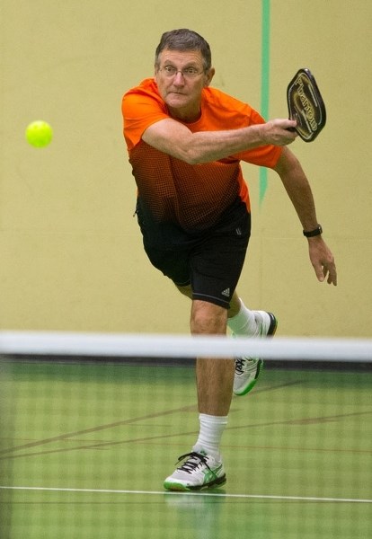 St. Albert Pickleball Club&#8217;s Wayne Richardson plays a game of pickleball during a club session.