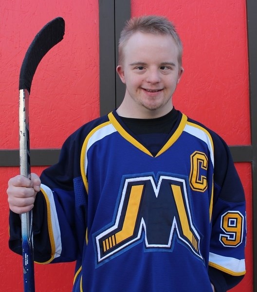 HOMETOWN PRIDE â€“ Christian Bayus of St. Albert is one of 10 runners/walkers selected for the hockey stick relay Saturday to signal the start of the Rogers Hometown Hockey