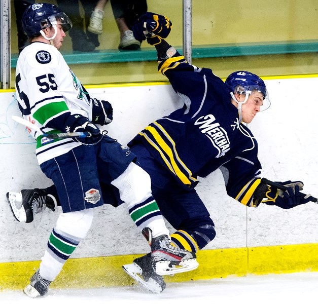 UPENDED â€“ Liam Thomas of the St. Albert Merchants is tripped up by Joel Wentworth of the Edmonton Mustangs during playoff action in the best-of-five junior B