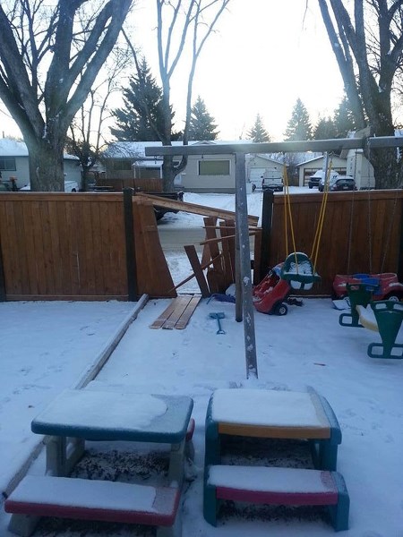 A Facebook user posted this photo of damage done to her fence in Grandin overnight on Monday. At least six fences were damaged in the city.