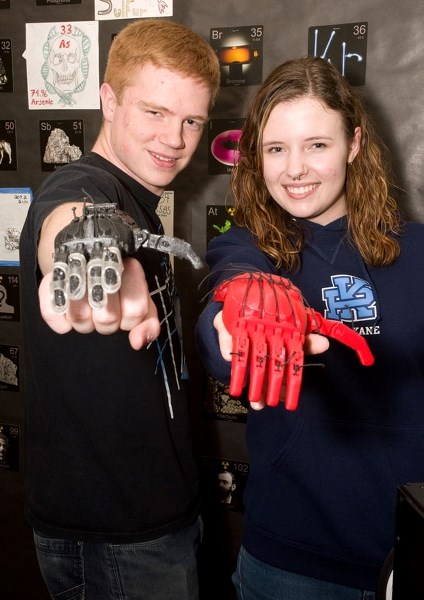 HANDS UP â€“ Paul Kane students Aidan Block and Michelle Koekemoer brandish the prosthetic hands they helped create on the school&#8217;s 3D printer. The school&#8217;s 3D