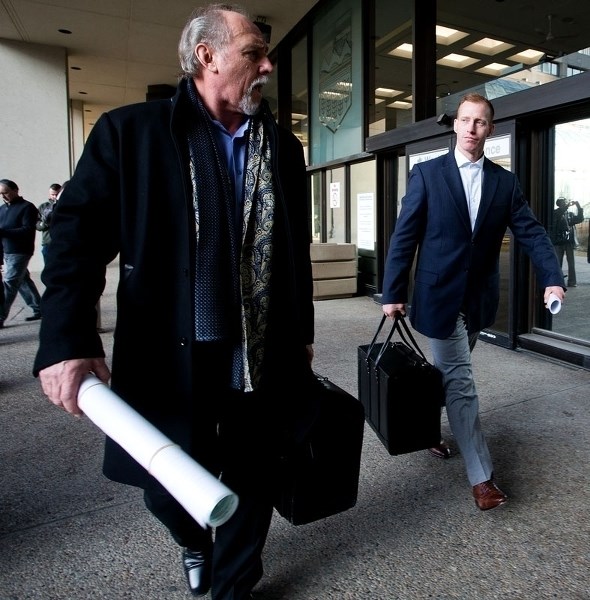 Travis Vader walks with his lawyer