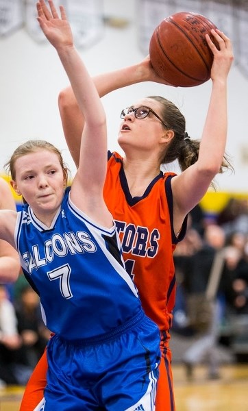 AIMING FOR THE HOOP â€“ Raeesa Cherniwchan of the Lorne Akins Gators eyes up a shot against Alex Black of the Richard S. Fowler Falcons in the SAPEC Tier I city final