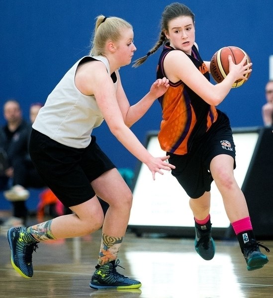 DRIVE TIME &#8211; Aine Murphy of the St. Albert SLAM midget A team pushes past a defender in Sunday&#8217;s 51-30 win over SBA Caldwell in the Youth Provincial Championships 