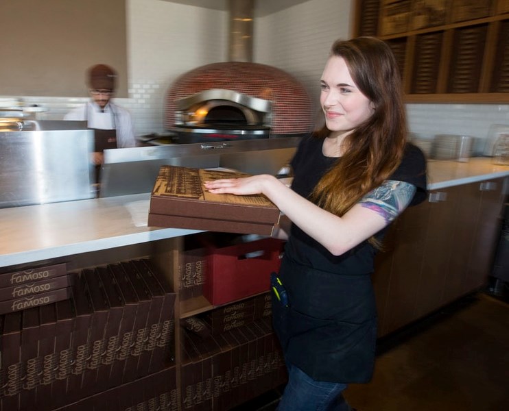 Heather Ljuden collects an order during her shift at Famoso Neapolitan Pizzeria in St. Albert.