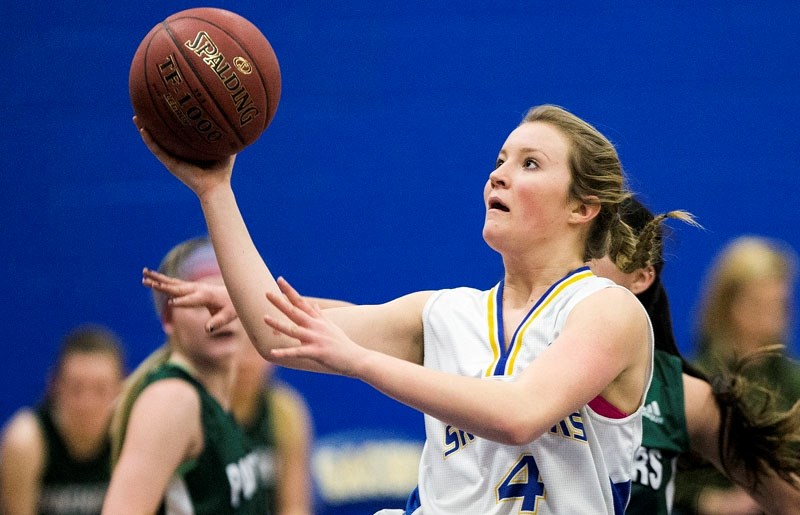BASKET WEAVER â€“ Jamie Bain attacks the hoop for the St. Albert Skyhawks