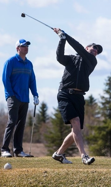 FORE! &#8211; Tony Nicholas (left) and Jamie Moores of Morinville hit the links at the Terra Pines Golf &amp; Country Club last weekend.