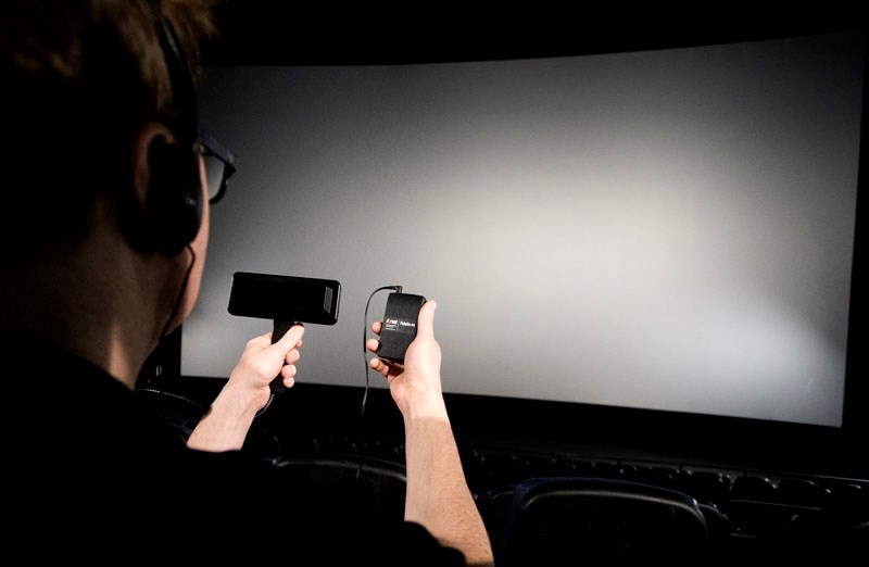 Cineplex Odeon Theatres offer CaptiView closed captioning (CC) devices &#8211; left &#8211; and Fidelio descriptive service (DS) devices &#8211; right &#8211; for specific