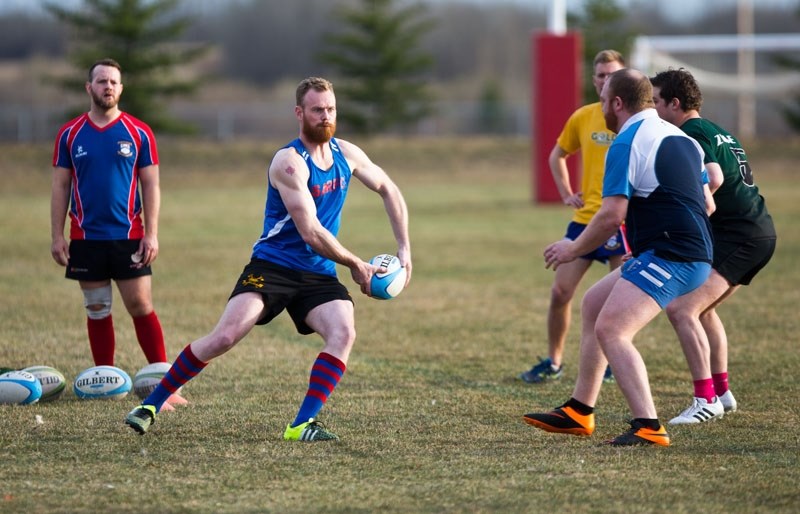 BALL PRESENTATION &#8211; Matt Herod performs a structure and play calling drill during Tuesday&#8217;s training session at the St. Albert Rugby Football Club. The 2015