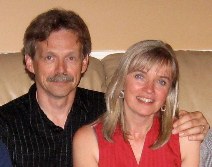 St. Albert husband-wife musicians John Taylor and Kathy Hogan embrace each other during happier times.