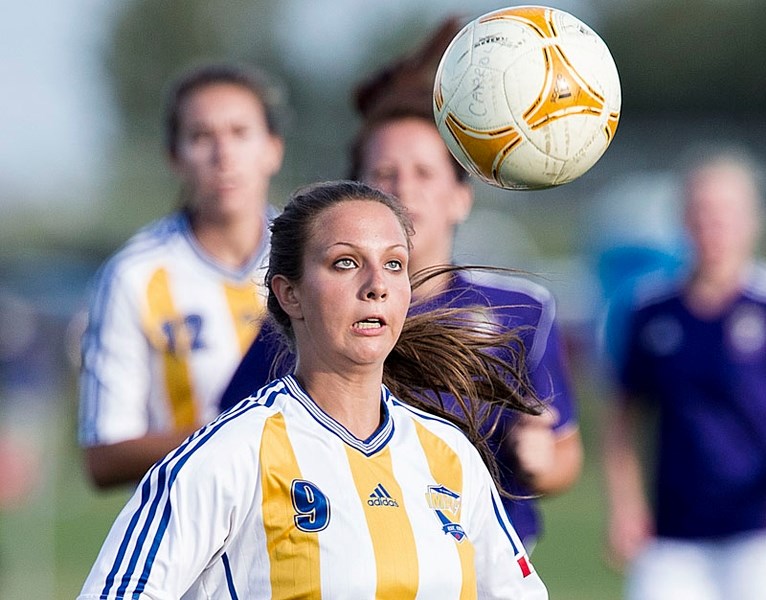 EYE BALL â€“ St. Albert Impact player Melanie Seidel lines up a header for the division 3A team last year in the Edmonton District Soccer Association. The EDSA champions and