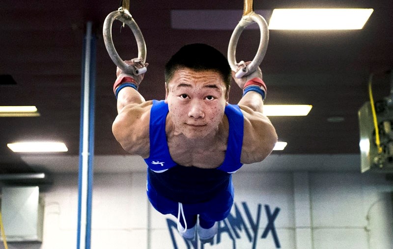 RINGS OF POWER â€“ Isaiah Wong works on his routine on the rings during Monday&#8217;s training session at the Dynamyx Gymnastics Club. Wong