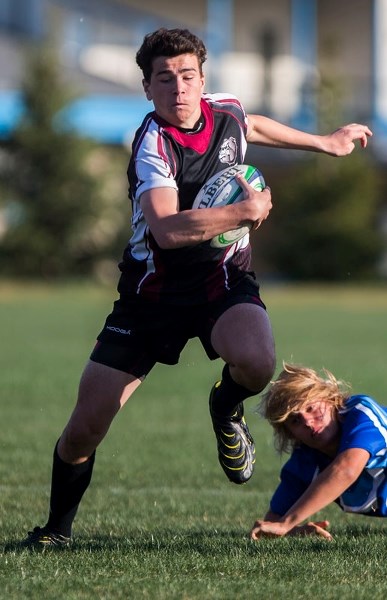 BREAKING AWAY &#8211; Ben Miller of the Bellerose Bulldog runs away from Henry Bordian in Thursday&#8217;s 20-7 victory over the Paul Kane Blues for the Gareth Jones Cup.