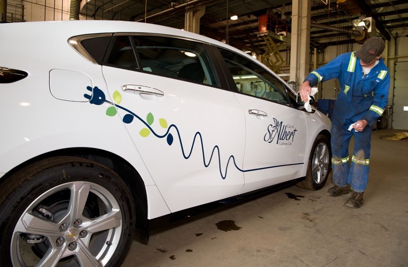SHOCKING RIDE â€” RAP student Evan Majeau polishes up one of St. Albert&#8217;s two new electric vehicles at the St. Albert Public Works yard Thursday. The vehicle is one of