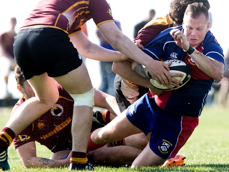 CAUGHT IN THE ACT â€“ Justin (Bomber) Armitt of St. Albert is hauled down by the Nor&#8217;Westers in the Alberta Cup season opener Saturday at the Nor&#8217;Westers Rugby