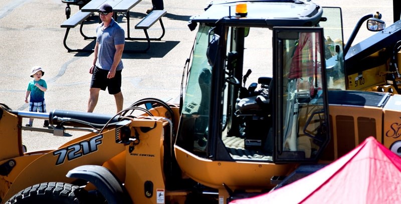 A youngster checks out a front end loader at the Public Safety open house on Sunday June 5.