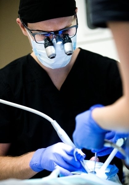 DR. TOOTH TO THE O.R. â€“ Dr. Brett Shkopich performs dental surgery on a patient at Nuvo Dental on Thursday May 19. Shkopich is working with the Sturgeon Community Hospital