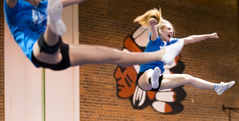 GO BLUES GO â€“ Paul Kane STUNT cheerleader Kimberly Peever performs during the team&#8217;s competition against the Victoria School of the Arts on Tuesday May 31