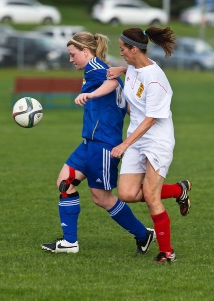 FOLLOW THE BALL â€“ Shannon MacGillivray of the St. Albert Impact is marked by a defender in Wednesday&#8217;s division 1B match against the Angels Scottish Classics in the