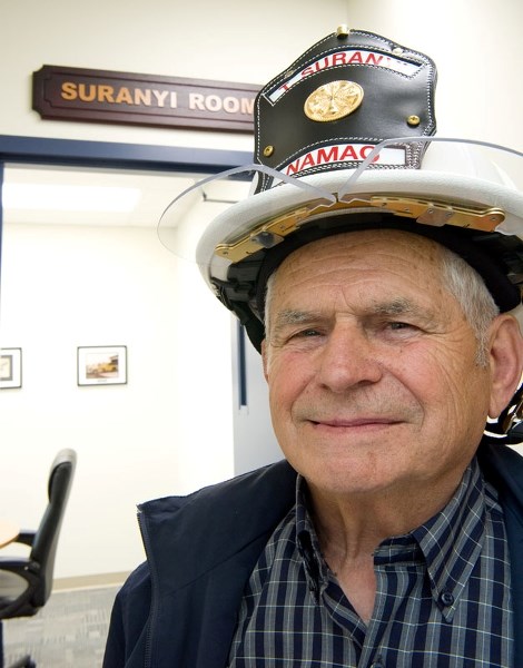 CHIEF&#8217;S ROOM â€“ Carbondale resident Ted Suranyi wears an updated copy of his old fire chief&#8217;s helmet at the opening ceremony for the new Sturgeon County