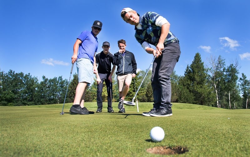 MONEY MEN â€“ Jeremy Blazuk putts for par for his team of Jake Mercier