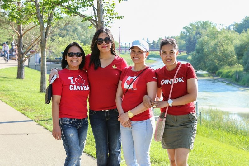 Canada Day concert-goers pose for a photo at St. Albert Place.
