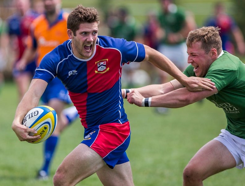 MAN ON THE RUN â€“ Duncan Maguire shouts for support while chased by a Calgary Irish player in Saturday&#8217;s premier men&#8217;s match at the St. Albert Rugby Football