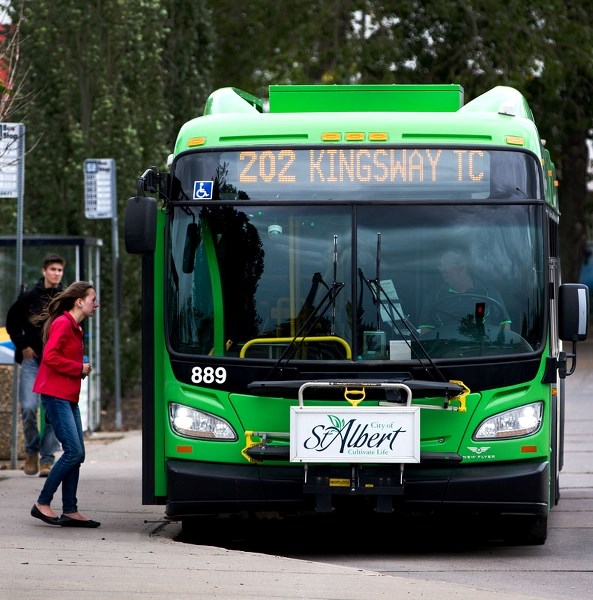 A woman boards a St. Albert Transit bus destined for Kingsway at the St. Albert Centre terminal earlier this month.