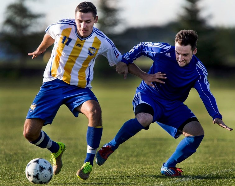 FOOTY â€“ Ovi Beschieru (17) of the St. Albert Impact division 1B men&#8217;s team gets a foot on the ball in Wednesday&#8217;s 2-2 draw against the Scona Blues at Riel Park. 
