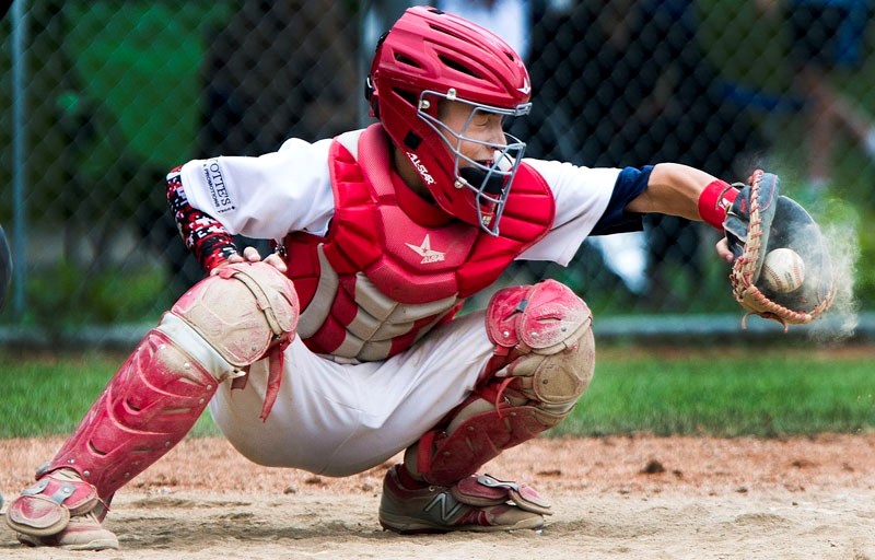 RECEIVER â€“ Kade Knight of the St. Albert Cardinals catches a strike in Saturday&#8217;s game against the South Jasper Place Jays at the Baseball Alberta bantam AAA Tier I