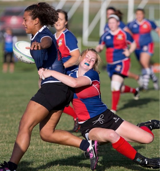 GRIPPING TACKLE â€“ Mckenzie Pusch of the St. Albert Rugby Football Club tackles a Clan player during a first division women&#8217;s match. Pusch