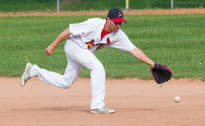 BALL RETRIEVAL â€“ Emerson Buck makes a play for the ball for the St. Albert Senior (30-plus) Cardinals in the Alberta West Central Baseball Association. Tuesday the