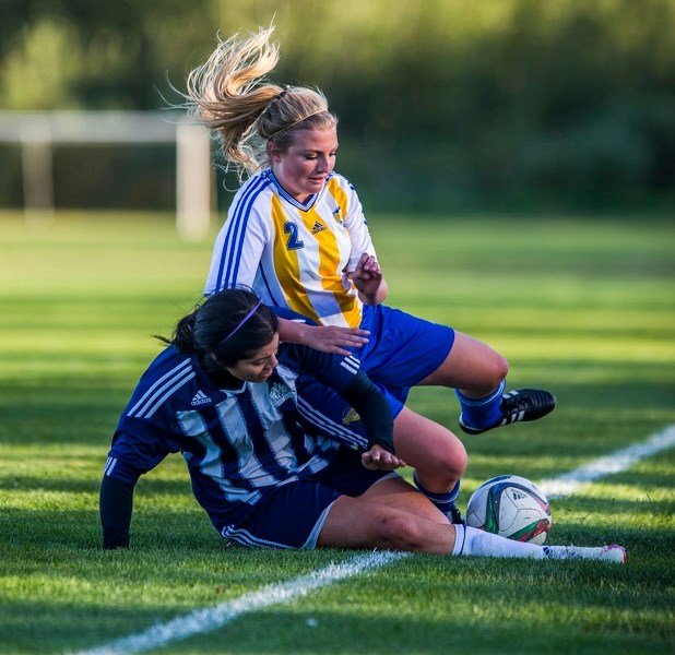 BALL MARKER â€“ Rene Takats of the first-place St. Albert Impact division 2A team battles for the ball along the touchline in the Edmonton District Soccer Association Tier II 
