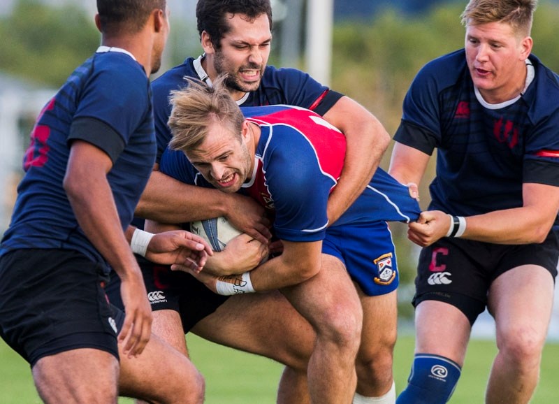 TRAPPED â€“ Antony Fitch of the St. Albert Rugby Football Club is caught in the act by a trio of Clansmen in Friday&#8217;s Alberta Cup premier division match at Airways