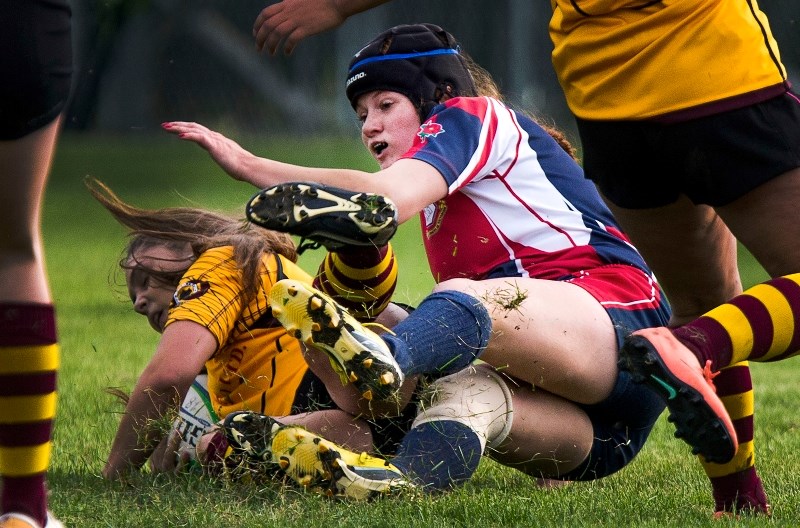 GROUNDED â€“ Kendall Dewitt takes down a Nor&#8217;Wester for the St. Albert Rugby Football Club U18 ladies in the Edmonton Rugby Union junior final Monday. Dewitt scored one 